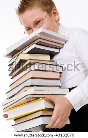 Little boy carrying books stack. Isolated