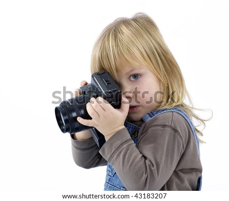 Young girl, child, trying to shoots photos on white background