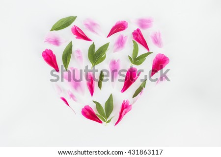 Cute vintage photography with flowers, petals an leaves Flat lay top view. Minimalistic photo for blogs, websites, social media platforms. Heart shape.
