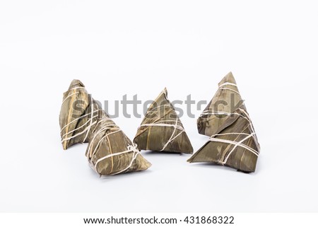 Chinese sticky rice dumplings (Zongzi) made of sticky rice, reed/bamboo leaf isolated with white background, ussually taken during Traditional Food festival to celebrate Dragon 