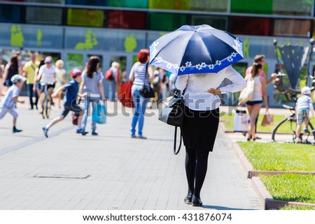 Women with umbrella in a sunny day