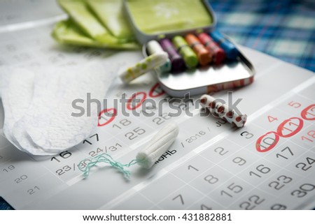 Woman hygiene protection, close-up.menstrual calendar with cotton tampons