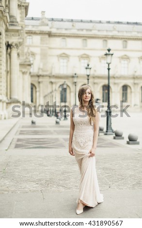 amazing  young bride walking on the street