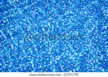 swimming pool water with sun reflections