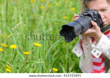 image of a woman taking pictures