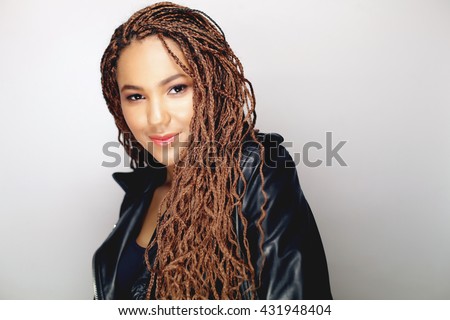 Close up portrait of a beautiful young african american woman wearing black leather jacket