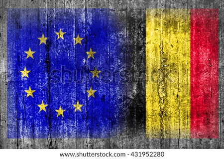 EU and Belgium flag on concrete wall 
