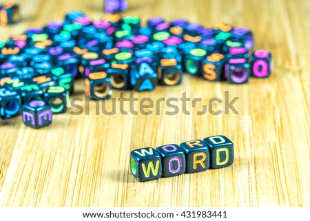 Colorful letter cube with bamboo texture surface. Educational concept.