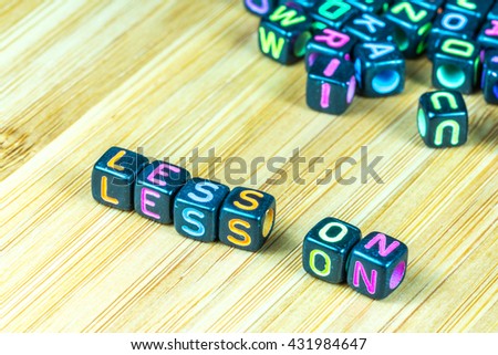 Colorful letter cube with bamboo texture surface. Educational concept.