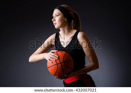 Woman with basketball in sport concept