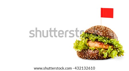 Juicy delicious burger on a bun dark on a white background with a red flag
