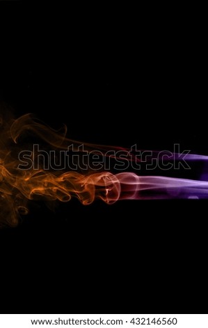 Movement of smoke,orange and purple smoke on black background,orange and purple ink background,smoke background ,beautiful smoke