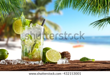 Summer cocktail with blur beach on background Royalty-Free Stock Photo #432153001