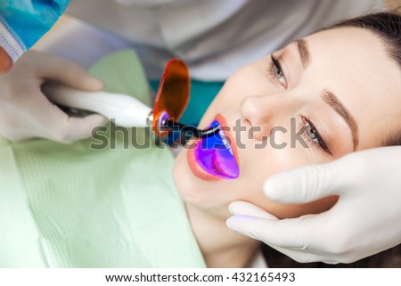 Close-up portrait of a female patient getting a bleach treatment in clinic Royalty-Free Stock Photo #432165493
