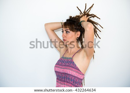 Girl with dreadlocks posing in studio 