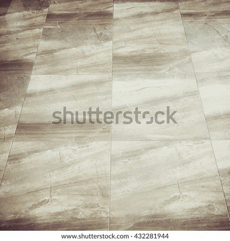 Marble floor tiles, squared image, muted retro filter
