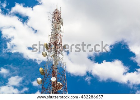 Telecommunication mast television antennas on blue sky and cloud