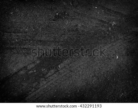 Tire tracks on the road gravel stone background