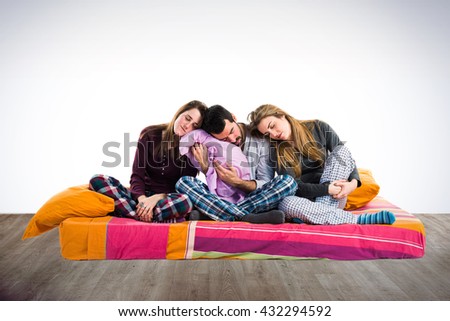 Three friends on a bed sleeping