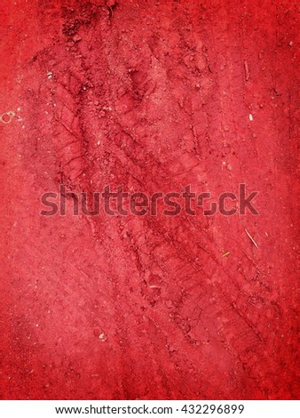 Tire tracks on the red road gravel stone background