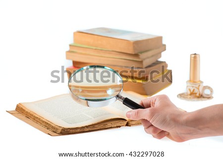 Magnifier search of old books on white background