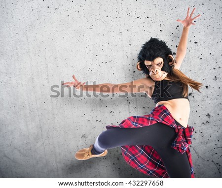 Woman with monkey mask dancing