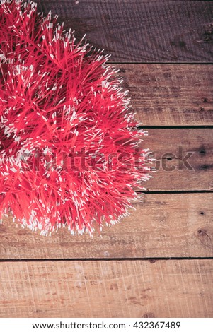 tinsel on a wooden background