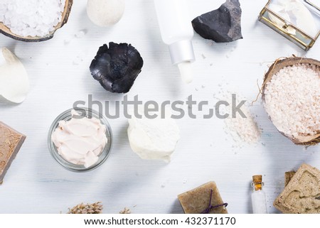 beauty and spa products on white wood table