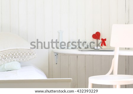 white romantic bedroom in a rustic wooden house workplace