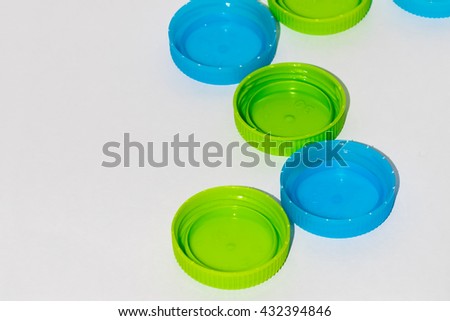 Green and blue water cap in a row. you can put some message in the picture for explain something to the people around the world.