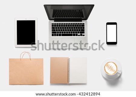 Design concept of mockup tablet, notebook, cell phone, book, coffee set isolated on white background. Copy space for text and logo. Clipping Path included isolated on white background.