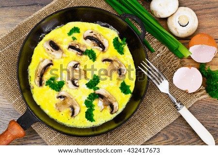 Healthy and Diet Food: Scrambled Eggs with Mushrooms and Vegetables. Studio Photo