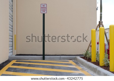 No Parking in the loading zone sign in designated area