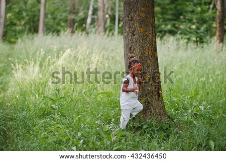 African baby girl walking at park