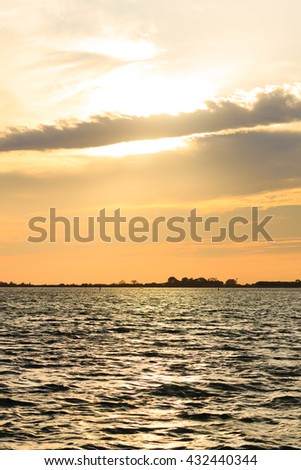 Sunset over water from "Delta del Po", Italian landscape. water and sky