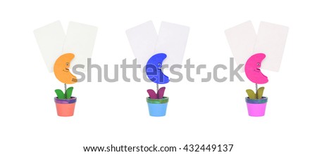Closeup clamp photo in brown moon , blue moon , pink moon shape in flowerpot with white blank paper isolated on white background
