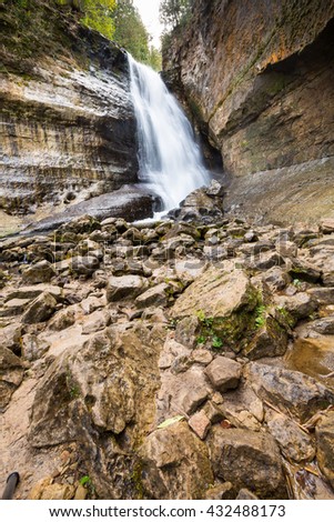 Miners Falls at Pictured Rocks National Lakeshore in the Upper Peninsula of Michigan. Jumbled rocks create the creekbed for Miners River