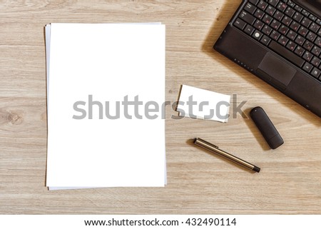 Office desk chaos set mock up template with paper sheet, business card, pen, flash usb drive, old notebook. View from above with white blank for text or design. Top view