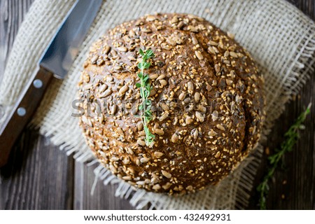 freshly baked multigrain bread on rustic background