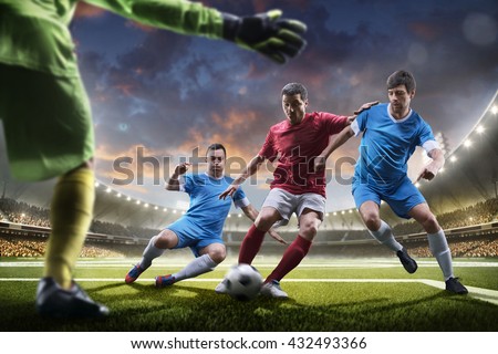 Soccer players in action on sunset stadium background panorama Royalty-Free Stock Photo #432493366