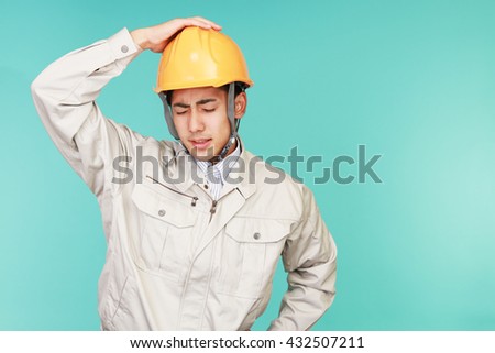Tired and stressed Asian worker 