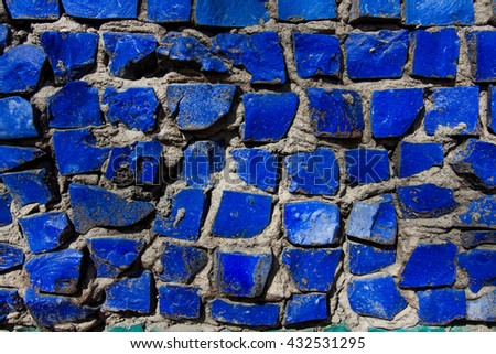 Coloured mosaic of bricks. Historic building.. Can be used for design, websites, interior, background, backdrop, texture creation, the use of graphic editors and illustration.