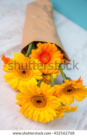 Gerbera in vase on a wooden table
