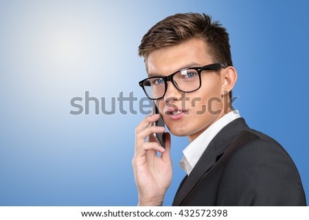 Portrait of a cheerful businessman talking on the phone