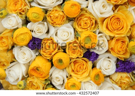 Wedding flowers in yellow and white with a touch of purple