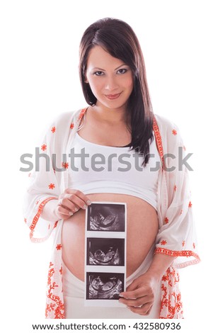 Beautiful pregnant woman on a white background with a picture of an unborn child