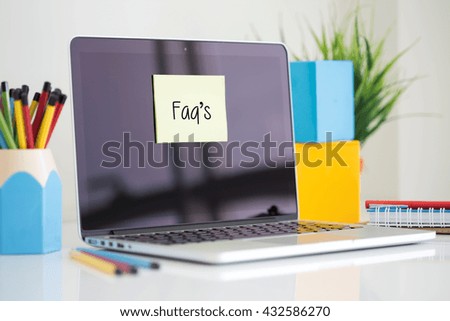 Faq's sticky note pasted on the laptop