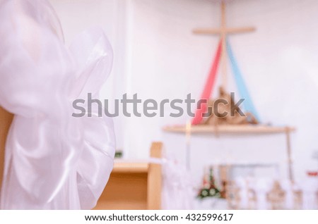 Christian wedding flower and decoration with cross and jesus in background