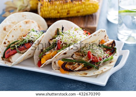 Vegan tacos with grilled tofu, herbs and vegetables
