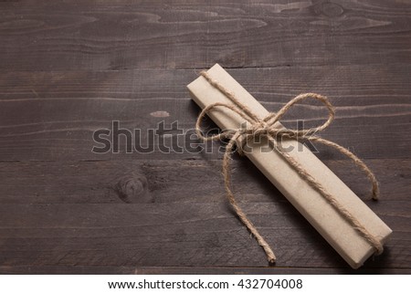 Gift boxes are on the wooden background with empty space.